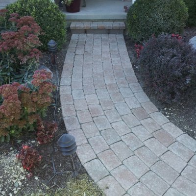 Paver walkway with retaining wall block step